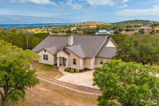 A traditional limestone home sitting on a few acres in the Kerrville Hill Country.
