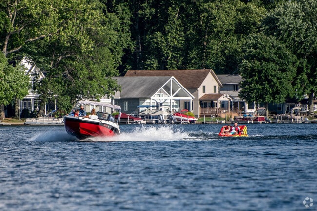 Residents of Portage Lakes have fun tubing or water skiing during the speed hours on the lake.