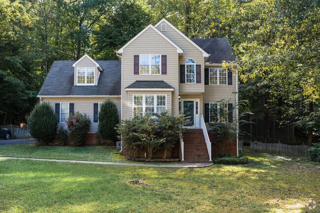 This Atlee Queen Anne home has asymmetry, rich textures, and picturesque style.