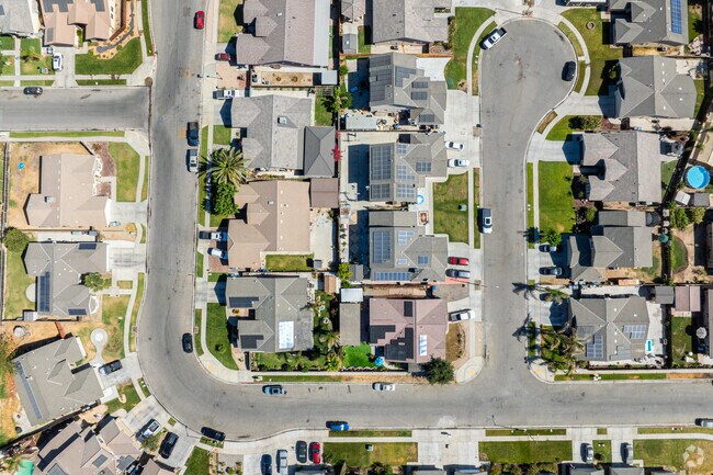 Italian cypress trees border the quiet streets.