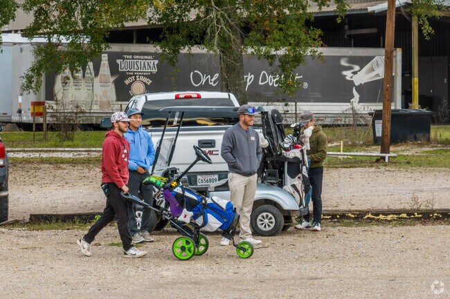 A group of golfers heads out for a round of golf at St Martinville's Eagle Ridge Golf Club.