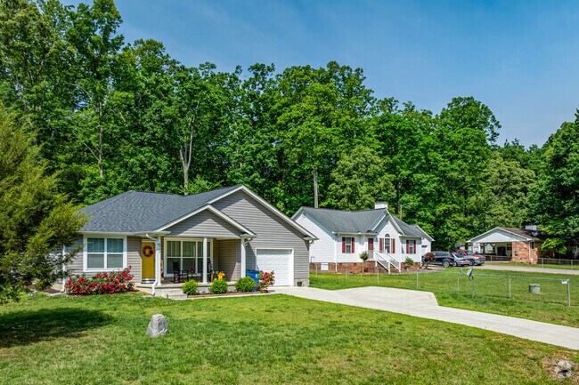 Homeowners in Pleasant Garden often have large lots with mature trees.