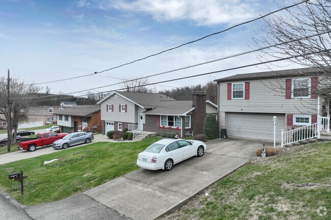 A street view of houses in Rostraver Twp.