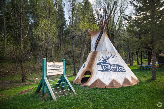 A large teepee is located on the grounds of the Indian Hills Community Center.