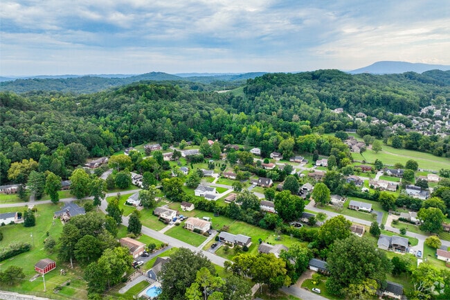 Homes of Lupton City-Norcross are established on the foothills of the mountainous terrain.