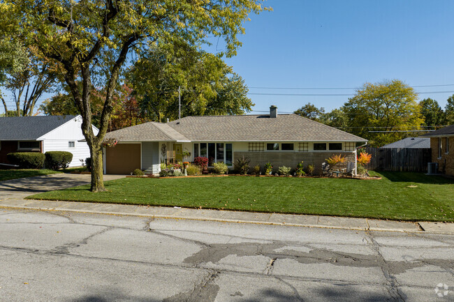 Brick ranch home nestled within the picturesque enclave of Interurban Acres.