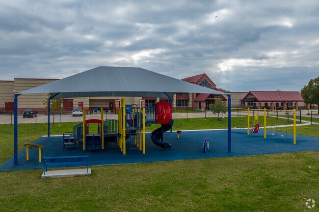Larson Elementary playground has many amenities in  Grand Prairie, TX.