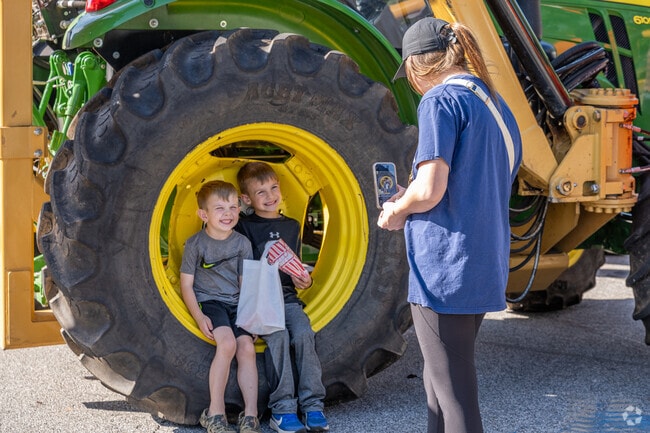 The vibrant trucks and powerful tractors at the Commerce Touch a Truck event create fantastic photo opportunities, allowing attendees to capture the excitement and rugged charm of these impressive vehicles up close.