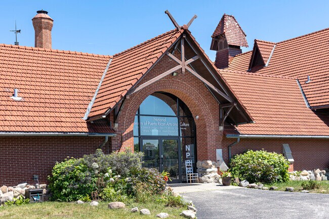 The National Museum of Puerto Rican Arts inhabits a historic Tudor style building in the park.