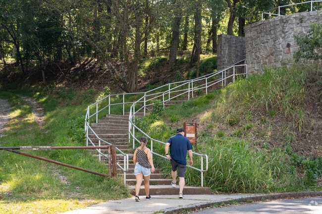 Hikers ascend the final steps to the uppermost lookout point of Kennesaw Mountain in West Cobb.