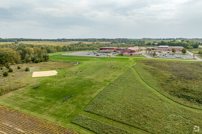There are athletic fields to the north of Spring Valley High School.