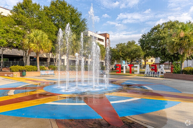 Enjoy the water feature at Parc Sans Souci in Downtown Lafayette.