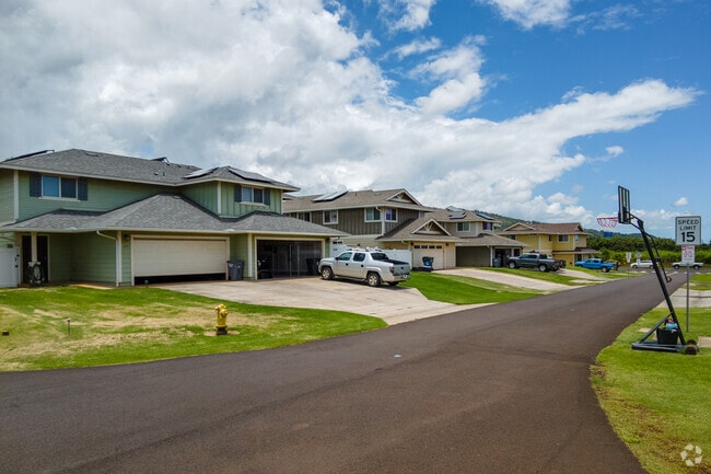 Large homes with enclosed garages and underground utilities are recent additions to the community in Lihue.