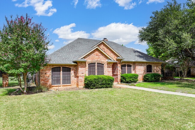 Traditional brick homes in Dalworthington Gardens offer spacious, fenced back yards.