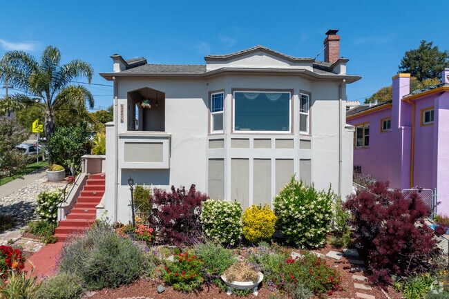 Homes with manicured front yards, adding timeless charm to Maxwell Park neighborhood.