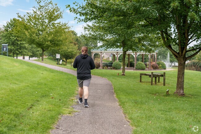 An Ogden walking trail next to a pavilion and a pond provides a peaceful escape.