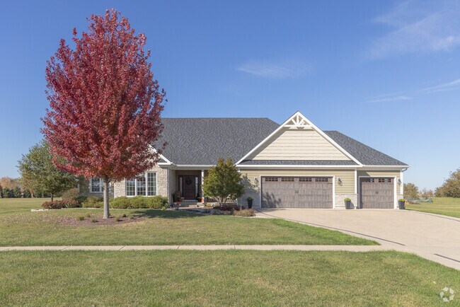 New traditional style property in Somonauk offering curb appeal, ample parking, and open lawns.