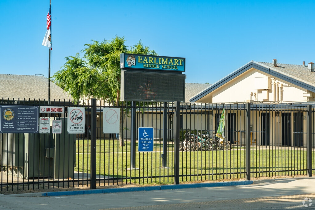 The American and California state flags are featured behind the marquee of Earlimart Middle School in Earlimart.