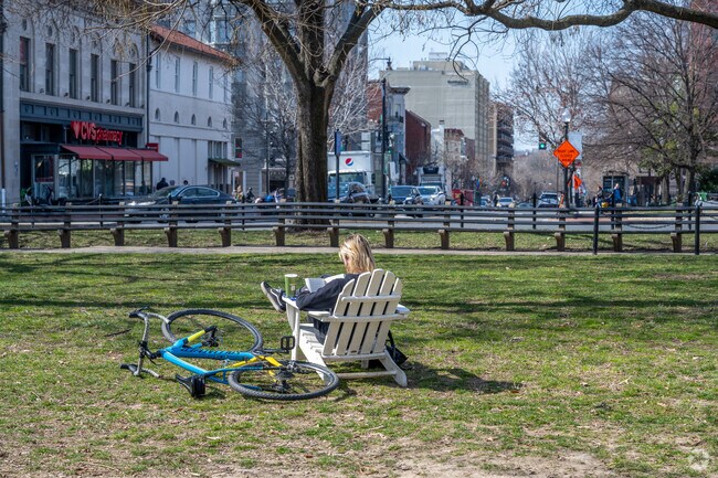 A few lawn chairs are set up around the Dupont Circle fountain in the center of the neighborhood