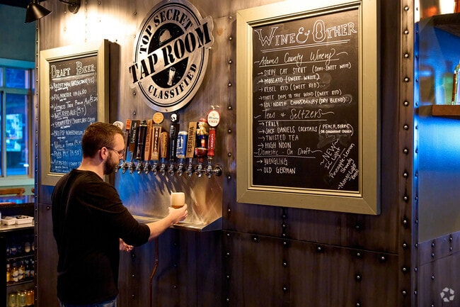A bartender pours a beer at the Top Secret Taproom in Ft. Ritchie.