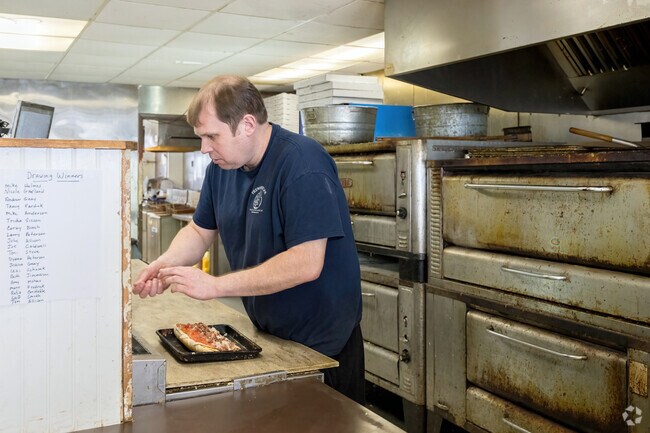 Frewsburger Pizza Shop in Frewsburg serves handcrafted pizzas and subs, a local staple in Chautauqua County's vibrant Main Street dining scene.