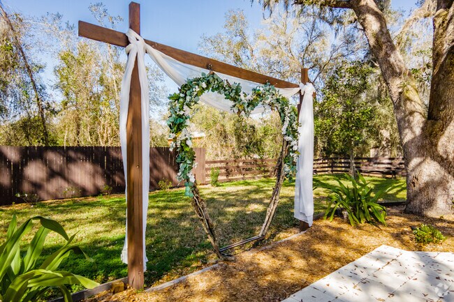 Romantic wedding arch outside of the Madison Barn Wedding Venue.