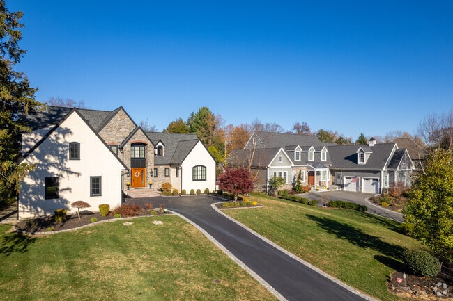 A pair of contemporary homes in Westminster with lovely stone work and landscaping.