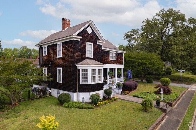 A classic wooden 2 story home in Beaumont Village.