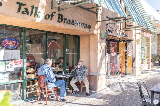 Some regulars at Talk of Broadway enjoy their morning coffee.