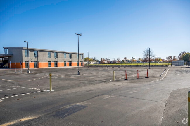 The entrance to Bell Avenue Elementary School has a large open parking area.