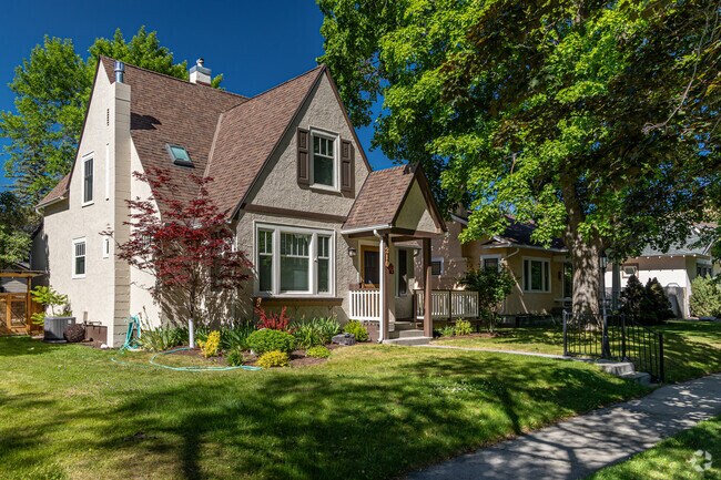 Mature trees keep front porches cool during the warm months of winter in University District.