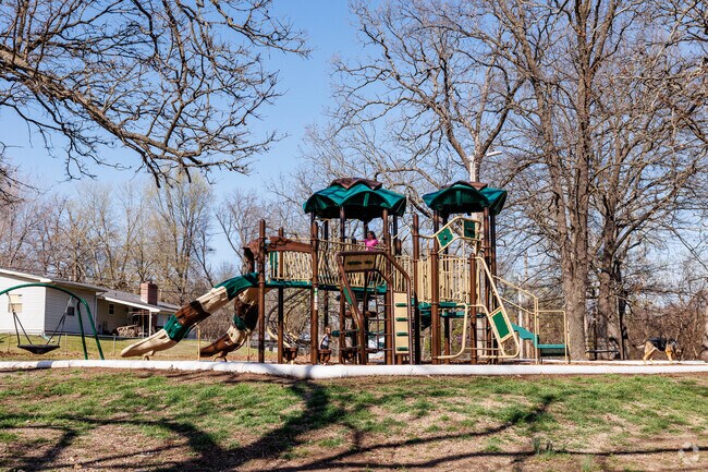 Children enjoy the playground at Center Creek Park.