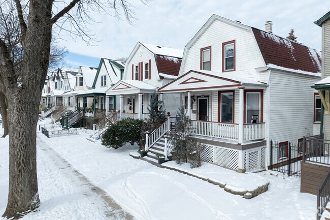 Homes in Bowmanville are neatly arranged on a grid with snowy sidewalks in Chicago.