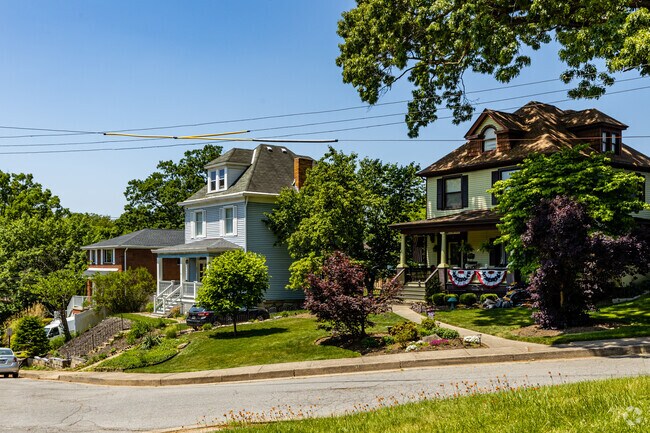 Homes line the streets of Avalon surrounded by trees and amazing landscaping.