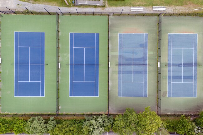 Maintenance of the tennis courts can be observed at Elizabeth I. Hastings Middle School.
