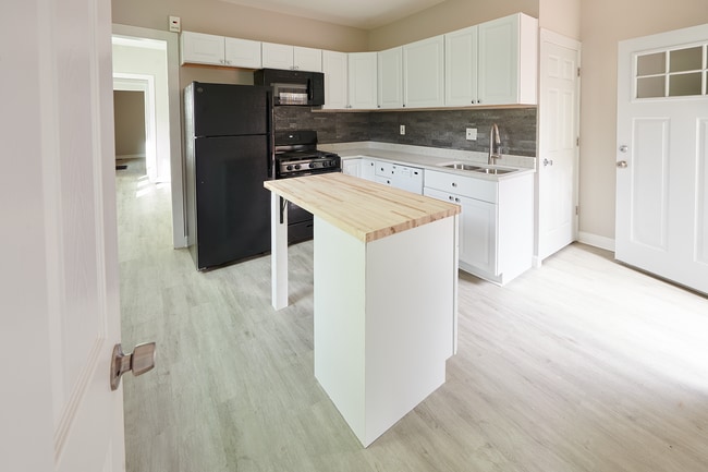 Large eat-in kitchen with all new appliances including a dishwasher and garbage disposal