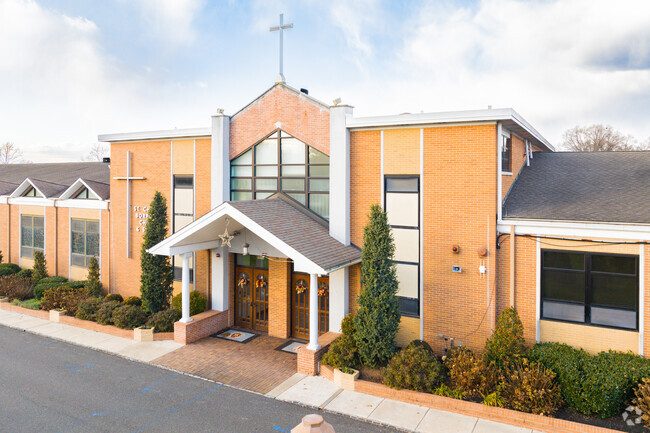 The timeless beauty of St. Charles Borromeo's architecture is highlighted against a vibrant sky.