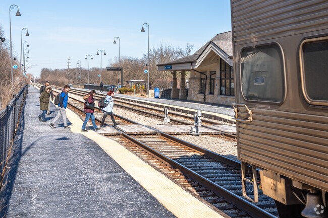 Commuters head home after a ride on the Metra Train near the Lake Katherine neighborhood.