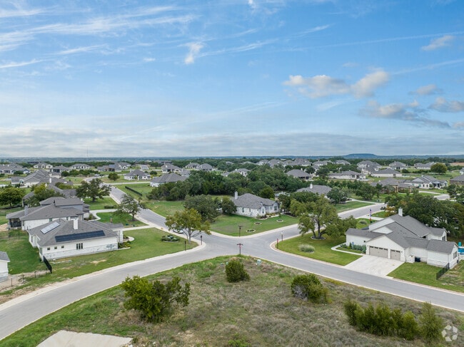 Liberty Hill homes are embraced by wide streets and stunning mature trees.