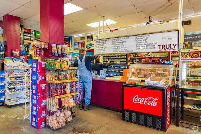 People do shopping in the S & H Mercantile of Luther neighborhood.
