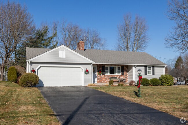 A large paved driveway welcomes you to this ranch style home in Thompson Hill.