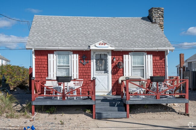 Enjoy the warm summer sun on the front porch of this adorable beach cottage in Humarock.