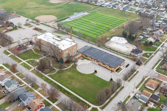 Aerial view of William C Bryant Elementary School and and football field in Old Brooklyn.