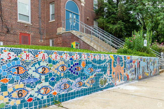 Vibrant mosaic mural in front of the Thomas Sharp Elementary School in Collingswood, New Jersey.