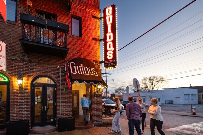 Enjoy the neon lit night life of The Hill at Guido's.