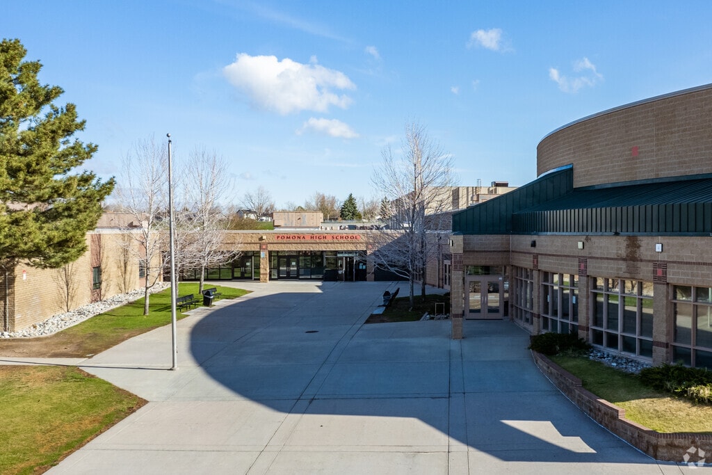 Meadowglen Pomona High School entrance on a blue sky day.