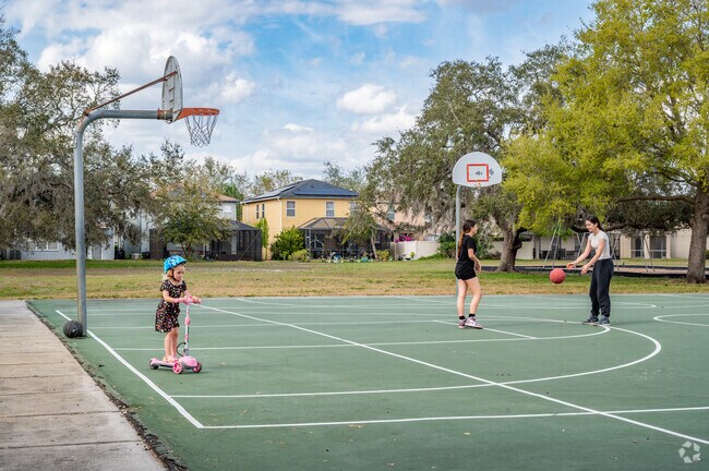 Next to the Concord Station clubhouse are a fenced play area, tennis courts and a full basketball court.