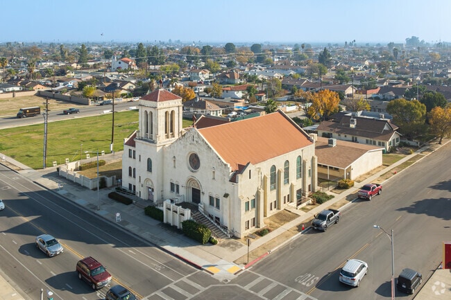 An old church stands tall over the homes of Downtown Delano.