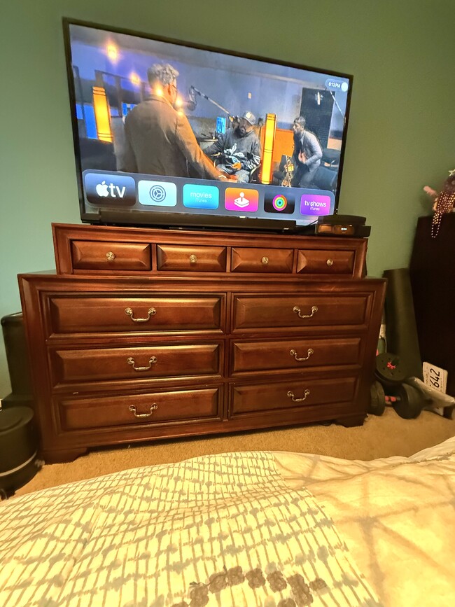 Dresser with 65 inch TV in Master Bedroom