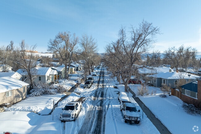 Tree-lined streets in Casper embrace the season with fresh snow and crisp blue skies.